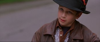 Movie still from “3000 Miles to Graceland” (2001), directed by Demian Lichtenstein – A young boy wearing a hat and a leather jacket; Close Up shot, High angle