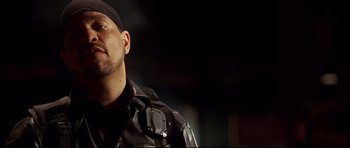 Movie still from “3000 Miles to Graceland” (2001), directed by Demian Lichtenstein – A person wearing a black jacket; Close Up shot, Low angle