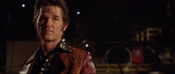 Movie still from “3000 Miles to Graceland” (2001), directed by Demian Lichtenstein – A person wearing a jacket; Close Up shot, Low angle