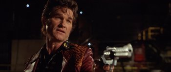 Movie still from “3000 Miles to Graceland” (2001), directed by Demian Lichtenstein – A man holding a video camera in his hand; Close Up shot, Low angle