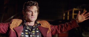 Movie still from “3000 Miles to Graceland” (2001), directed by Demian Lichtenstein – A person wearing a jacket; Close Up shot, Low angle