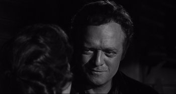 Movie still from “3:10 to Yuma” (1957), directed by Delmer Daves – A black - and - white photo of a man and a woman; Close Up shot, Over the shoulder angle