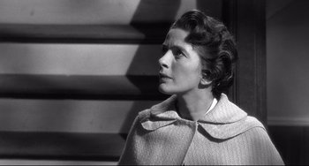 Movie still from “3:10 to Yuma” (1957), directed by Delmer Daves – An old photo of a woman looking to her left; Close Up shot, Low angle