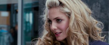 Movie still from “4.3.2.1.” (2010), directed by Mark Davis – A woman with blonde hair and green eyes; Close Up shot, Over the shoulder angle