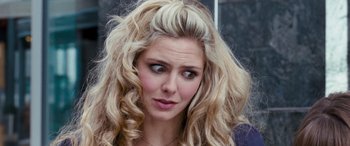 Movie still from “4.3.2.1.” (2010), directed by Mark Davis – A person with blonde hair; Close Up shot, Over the shoulder angle