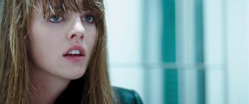 Movie still from “4.3.2.1.” (2010), directed by Mark Davis – A person with long brown hair; Close Up shot, Over the shoulder angle
