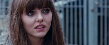 Movie still from “4.3.2.1.” (2010), directed by Mark Davis – A woman with long hair; Close Up shot, Over the shoulder angle