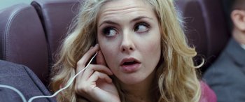 Movie still from “4.3.2.1.” (2010), directed by Mark Davis – A person talking on a cell phone; Close Up shot, Overhead angle