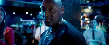 Movie still from “4.3.2.1.” (2010), directed by Mark Davis – A person wearing a black shirt; Close Up shot, Low angle