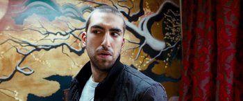 Movie still from “4.3.2.1.” (2010), directed by Mark Davis – A person wearing a jacket; Close Up shot, Low angle