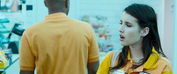 Movie still from “4.3.2.1.” (2010), directed by Mark Davis – A woman in an orange shirt talking to a man in an orange t - shirt; Close Up shot, Over the shoulder angle