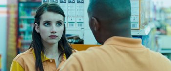 Movie still from “4.3.2.1.” (2010), directed by Mark Davis – A man and a woman looking at one another in an orange shirt; Close Up shot, Over the shoulder angle