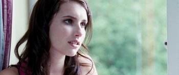 Movie still from “4.3.2.1.” (2010), directed by Mark Davis – A person with long hair; Close Up shot, Over the shoulder angle