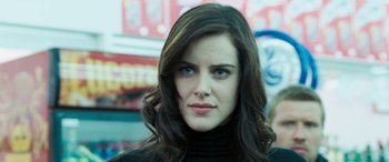 Movie still from “4.3.2.1.” (2010), directed by Mark Davis – A person with long hair; Close Up shot, Low angle