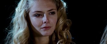 Movie still from “4.3.2.1.” (2010), directed by Mark Davis – A woman's face with long blonde hair; Close Up shot, Over the shoulder angle