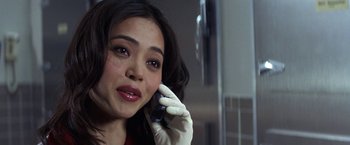 Movie still from “50 First Dates” (2004), directed by Peter Segal – A woman talking on a cell phone while wearing gloves; Close Up shot, Over the shoulder angle