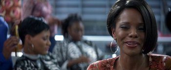 Movie still from “50 First Dates” (2004), directed by Peter Segal – A group of people sitting in a room; Close Up shot, Over the shoulder angle