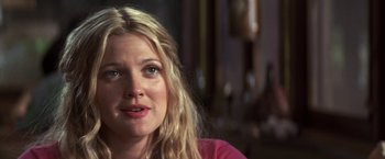 Movie still from “50 First Dates” (2004), directed by Peter Segal – A person sitting in front of a window; Close Up shot, Over the shoulder angle