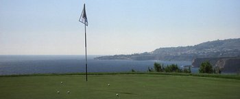 Movie still from “50 First Dates” (2004), directed by Peter Segal – A golf course with a view of the ocean and mountains; Extreme Wide shot, High angle