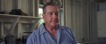 Movie still from “50 First Dates” (2004), directed by Peter Segal – A person wearing a blue dress shirt; Close Up shot, Low angle