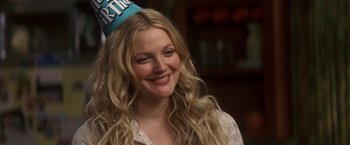 Movie still from “50 First Dates” (2004), directed by Peter Segal – A person wearing a party hat; Close Up shot, Over the shoulder angle