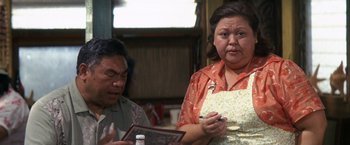 Movie still from “50 First Dates” (2004), directed by Peter Segal – An older man and a younger woman are looking at a picture; Close Up shot, Over the shoulder angle