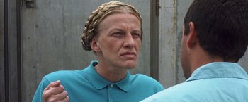 Movie still from “50 First Dates” (2004), directed by Peter Segal – A woman wearing a blue shirt with a braid in her hair; Close Up shot, Low angle