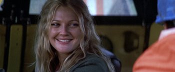 Movie still from “50 First Dates” (2004), directed by Peter Segal – A person with long blonde hair smiling; Close Up shot, Over the shoulder angle