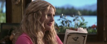 Movie still from “50 First Dates” (2004), directed by Peter Segal – A woman sitting in front of a window reading a book; Close Up shot, Over the shoulder angle