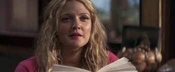 Movie still from “50 First Dates” (2004), directed by Peter Segal – A person reading a book; Close Up shot, Low angle