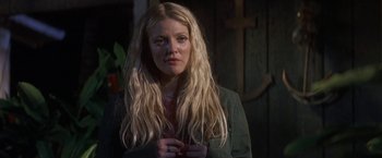 Movie still from “50 First Dates” (2004), directed by Peter Segal – A woman with long blonde hair standing in front of a wooden door; Close Up shot, Over the shoulder angle