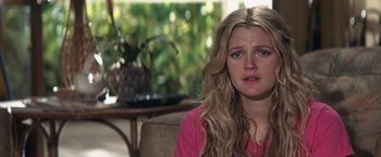 Movie still from “50 First Dates” (2004), directed by Peter Segal – A woman sitting on a couch looking sad; Close Up shot, Over the shoulder angle