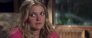 Movie still from “50 First Dates” (2004), directed by Peter Segal – A person with long blonde hair; Close Up shot, Over the shoulder angle