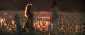 Movie still from “50 First Dates” (2004), directed by Peter Segal – A man and a woman standing next to each other in a field; Wide shot, Over the shoulder angle