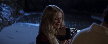Movie still from “50 First Dates” (2004), directed by Peter Segal – A woman is holding a camera up to her face; Close Up shot, Over the shoulder angle