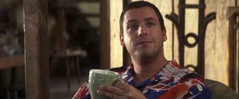 Movie still from “50 First Dates” (2004), directed by Peter Segal – A person holding a cup of coffee; Close Up shot, Over the shoulder angle