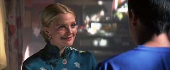 Movie still from “50 First Dates” (2004), directed by Peter Segal – A woman in a blue dress smiling for the camera; Close Up shot, Over the shoulder angle