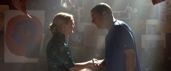 Movie still from “50 First Dates” (2004), directed by Peter Segal – A man and a woman holding hands in a room; Medium shot, Over the shoulder angle