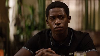 Movie still from “Snowfall” (2017), directed by Hiro Murai – A person with his hands crossed; Close Up shot, Over the shoulder angle