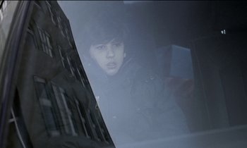 Movie still from “71 Fragments of a Chronology of Chance” (1994), directed by Michael Haneke – A young man is looking out of a car window; Close Up shot, Over the shoulder angle