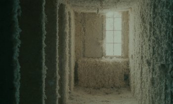 Movie still from “7 Rm., kit., ba...” (1984), directed by Agnès Varda – A room filled with lots and lots of white stuff; Close Up shot, Low angle