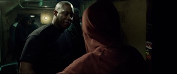 Movie still from “8 Mile” (2002), directed by Curtis Hanson – A man is talking to another man in a hooded jacket; Close Up shot, Over the shoulder angle