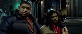 Movie still from “8 Mile” (2002), directed by Curtis Hanson – A couple of men standing next to each other on a street; Close Up shot, Low angle