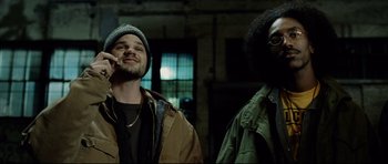 Movie still from “8 Mile” (2002), directed by Curtis Hanson – Two men standing next to each other in a room; Medium shot, Low angle