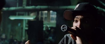 Movie still from “8 Mile” (2002), directed by Curtis Hanson – A person holding a video game controller in their hand; Close Up shot, Over the shoulder angle