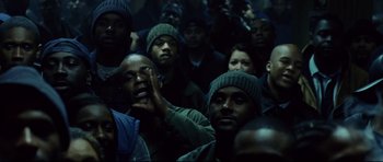 Movie still from “8 Mile” (2002), directed by Curtis Hanson – A group of people in a dark room; Medium shot, High angle