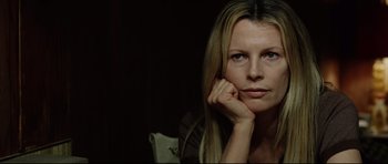 Movie still from “8 Mile” (2002), directed by Curtis Hanson – A woman sitting with her head resting on her hand; Close Up shot, Low angle