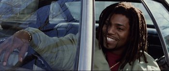 Movie still from “8 Mile” (2002), directed by Curtis Hanson – A man with dreadlocks is looking out of a car window; Close Up shot, Low angle