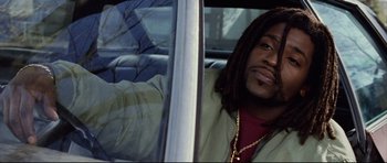 Movie still from “8 Mile” (2002), directed by Curtis Hanson – A man sitting in the passenger seat of a car; Close Up shot, Low angle