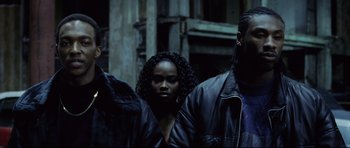 Movie still from “8 Mile” (2002), directed by Curtis Hanson – A group of people standing next to each other on the street; Medium shot, Low angle